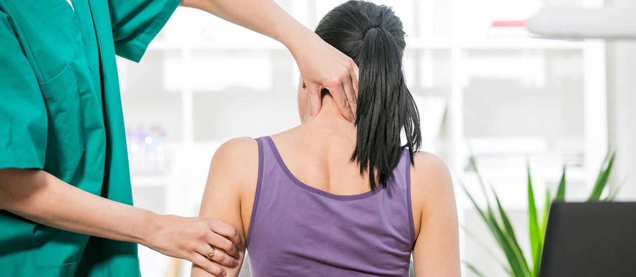 A patient with neck pain being examined by a doctor